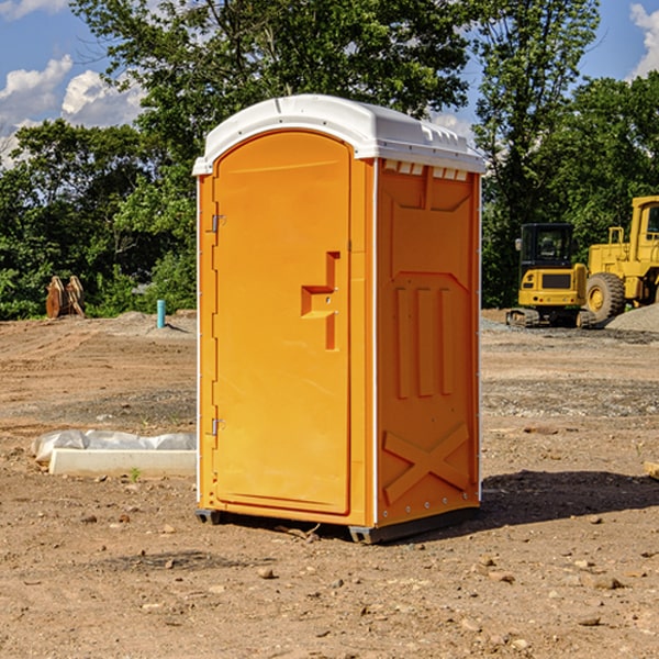 how often are the portable restrooms cleaned and serviced during a rental period in Freedom